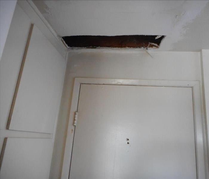 Pipe burst in ceiling.